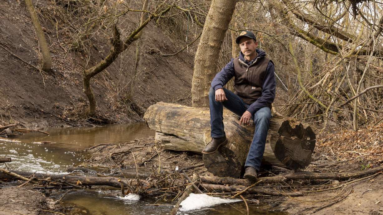 Will Munger, a doctoral student at Utah State University in the Department of Environment and Society, poses for a photo along Emigration Creek in Wasatch Hollow Preserve in Salt Lake City on April 15.