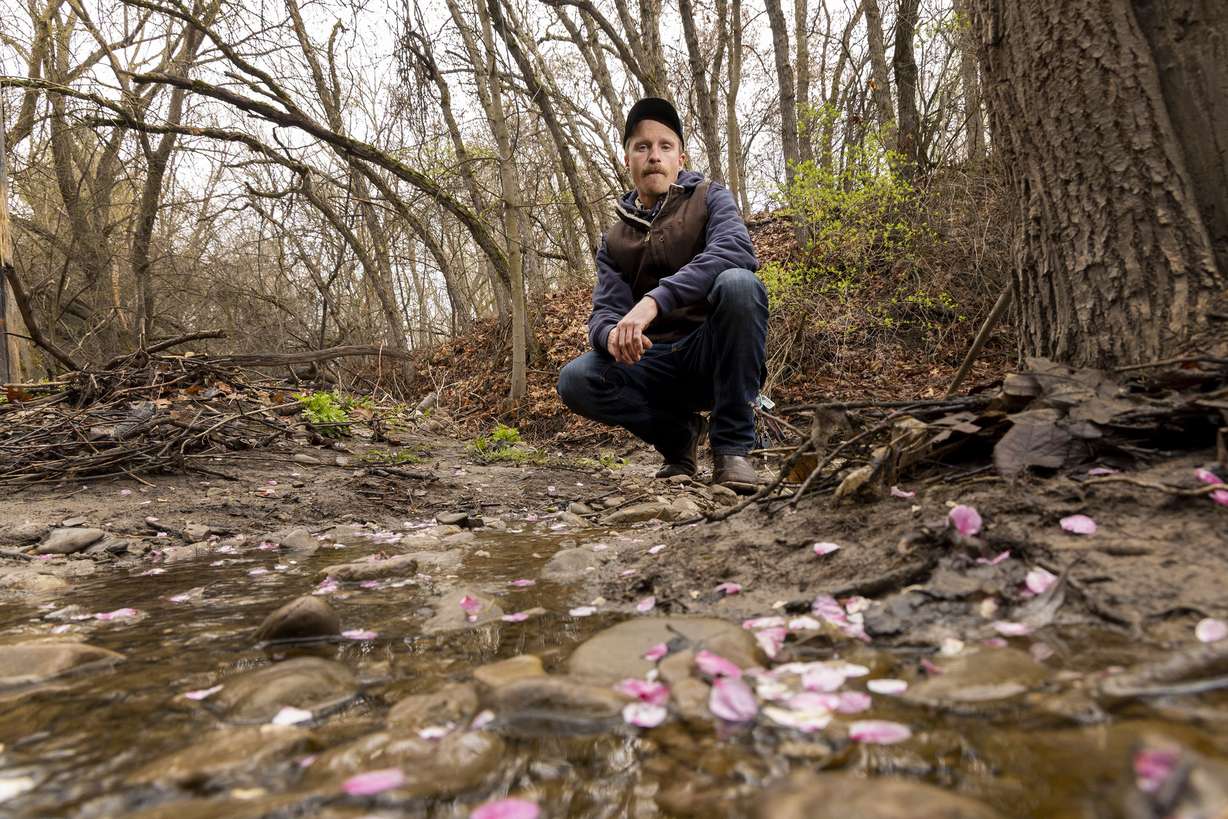 Will Munger, a doctoral student at Utah State University in the Department of Environment and Society, poses for a photo along Emigration Creek in Wasatch Hollow Preserve in Salt Lake City on April 15.