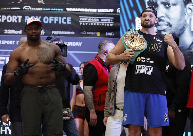 Boxing - Tyson Fury v Dillian Whyte Weigh-In - BOXPARK Wembley, London, Britain - April 22, 2022 Tyson Fury and Dillian Whyte during the weigh-in Action Images via Reuters/Andrew Couldridge