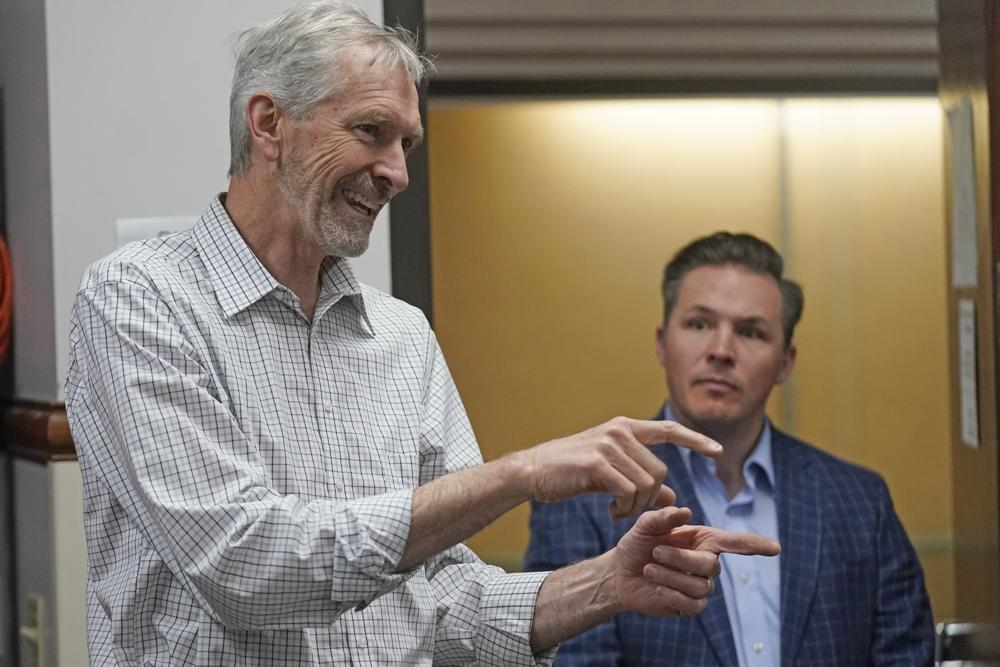 Republican candidate for Utah County Clerk, Aaron Davidson, left, and outgoing Utah County Clerk, Josh Daniels, look on during a tour of Utah County's elections equipment and review processes for administering secure elections Tuesday in Provo. Election fraud claims have upended support for vote-by-mail.