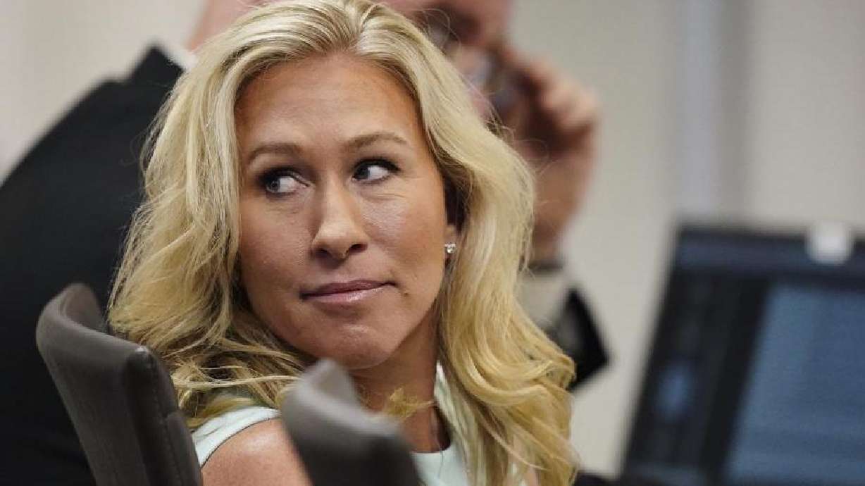 U.S. Rep. Marjorie Taylor Greene sits in the courtroom, Friday, in Atlanta in a challenge filed by voters who say she shouldn't be allowed to seek reelection because she helped facilitate the attack on the Capitol.