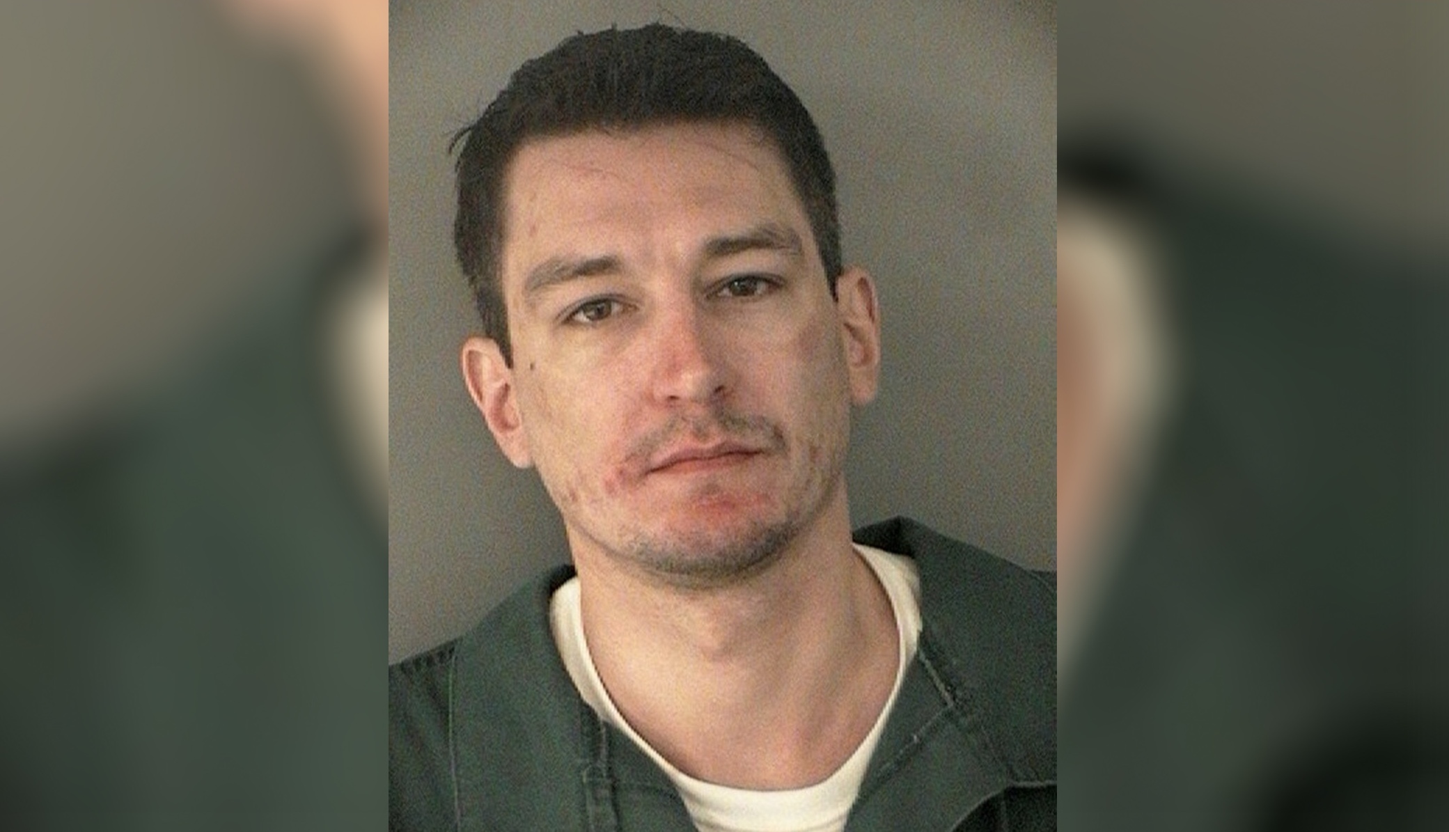 Arian Taherzadeh is seen in a police mugshot taken in July 2013 after he was arrested for assault and battery on a family member, a charge that he was subsequently convicted of after pleading guilty. Taherzadeh has now been charged by U.S. federal prosecutors with impersonating a federal law enforcement agent and additional weapons charges in April, 2022.