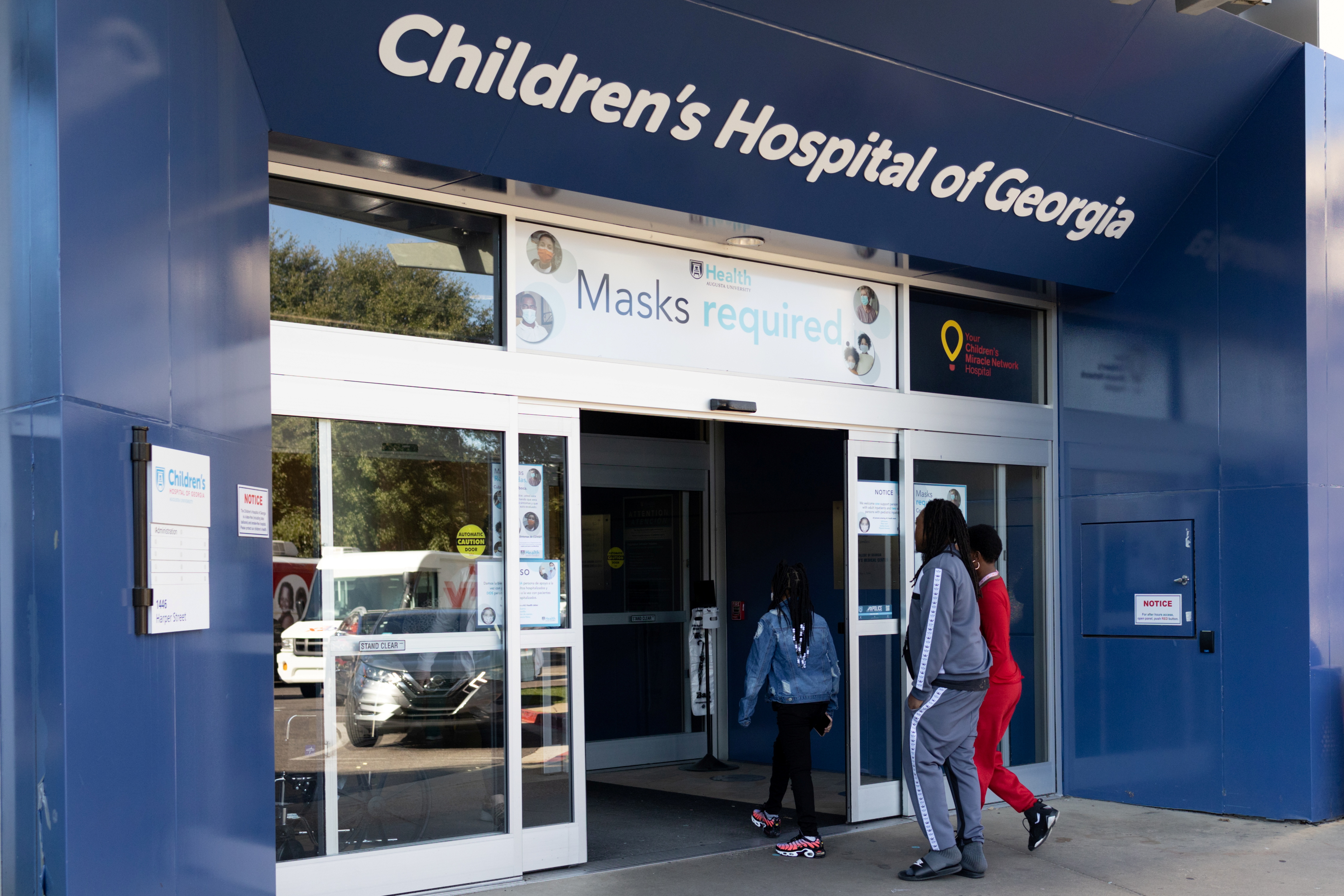 People walk into the Children's Hospital of Georgia in Augusta, Ga., on Jan. 14. U.S. health officials have sent out a nationwide alert warning doctors to be on the lookout for symptoms of pediatric hepatitis, possibly linked with a cold virus.