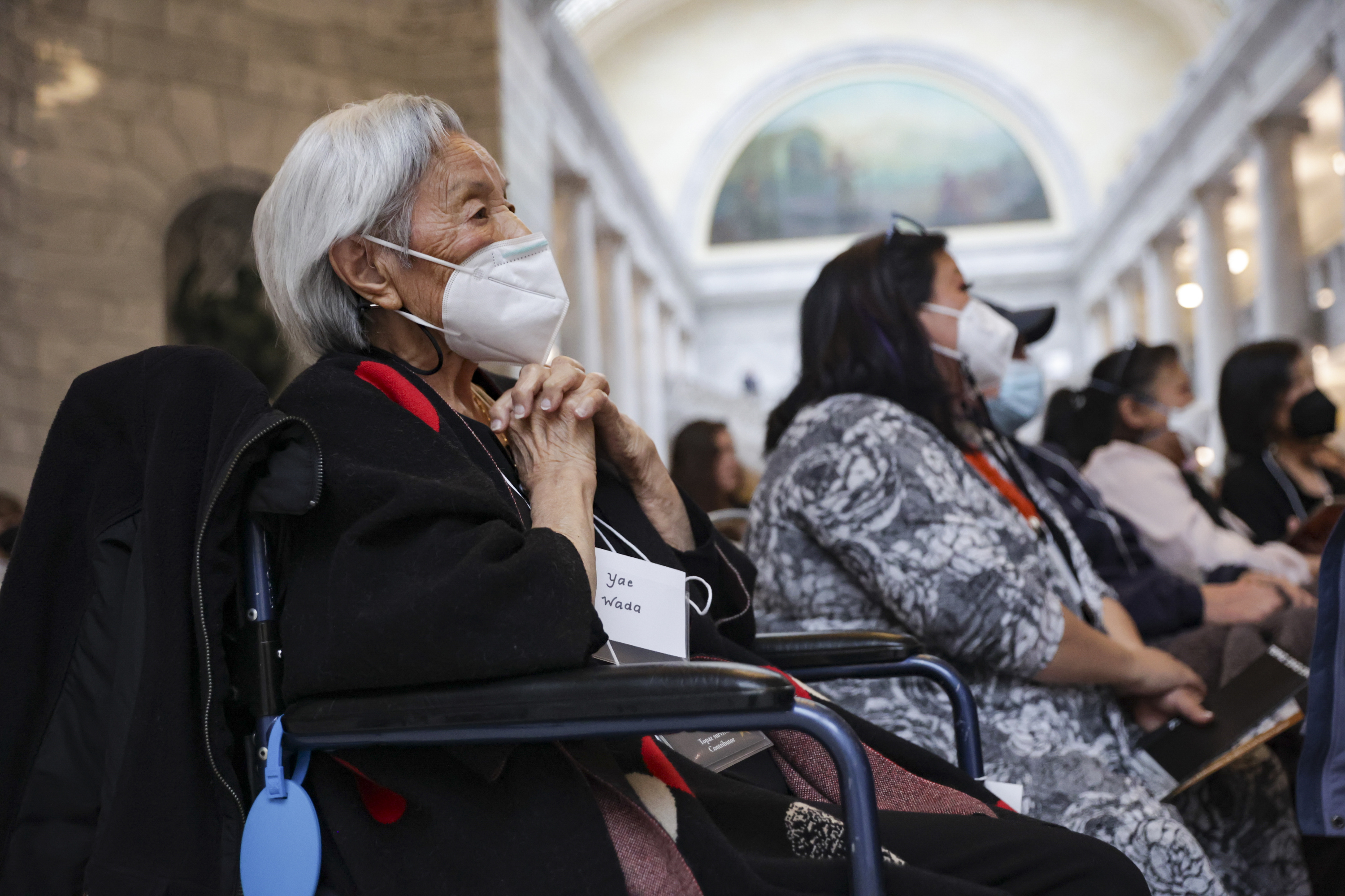 Yea Wada, a survivor of Topaz Camp, listens to the stories at the reception for the Topaz Stories exhibition at the Capitol in Salt Lake City on Friday.