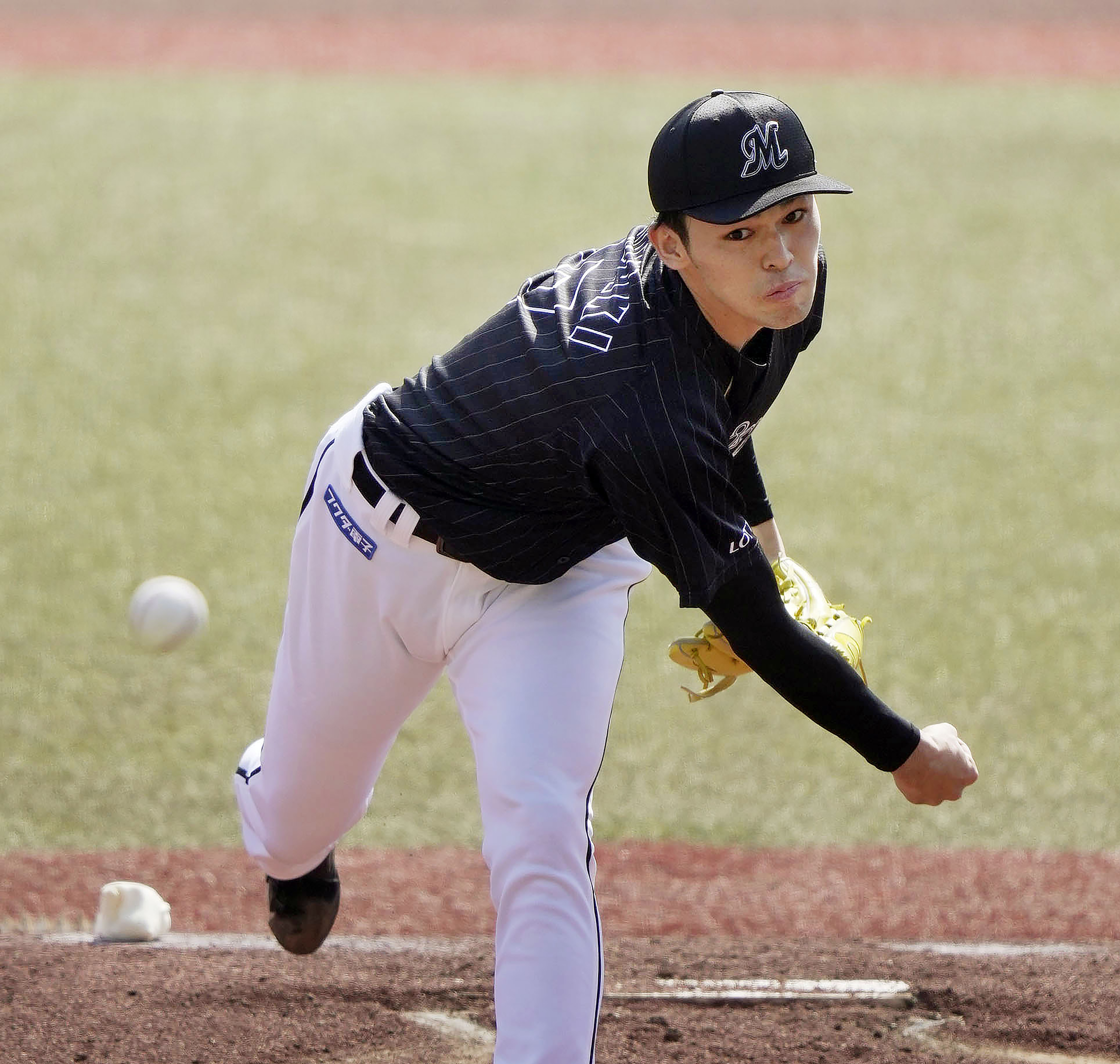 FILE - Chiba Lotte Marines Roki Sasaki pitches during a game against the Orix Buffaloes in Chiba, near Tokyo, Sunday, April 10, 2022. Japan's 20-year-old Sasaki almost did it again. A week after pitching a perfect game, the first in Japanese professional baseball in 28 years, Sasaki was perfect on Sunday, April 17, through eight innings before being pulled after throwing 102 pitches. 