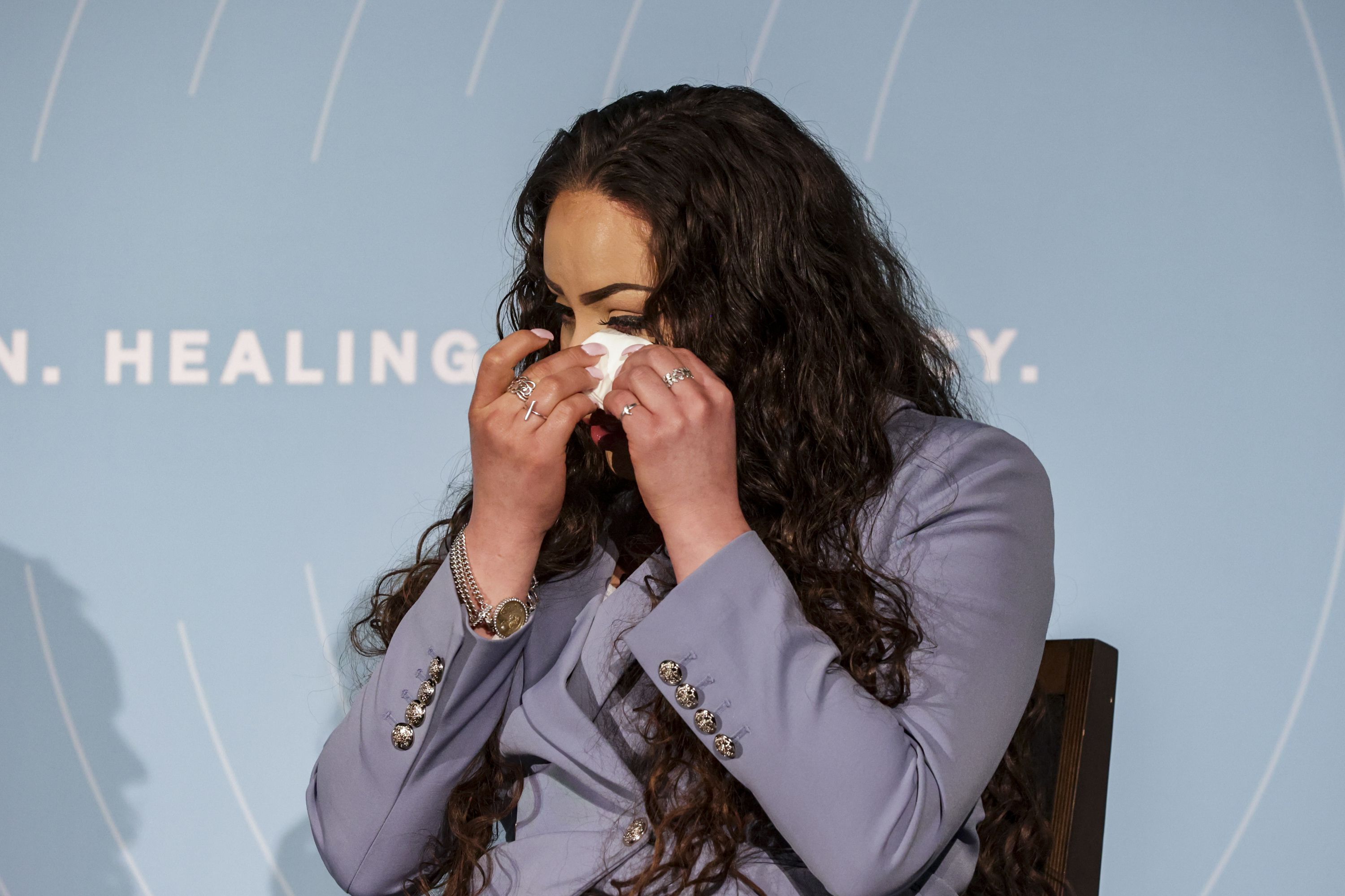 Suzie Skirvin, a human trafficking survivor, wipes away a tear during a Malouf Foundation summit on child sexual exploitation held at the Utah Museum of Contemporary Art in Salt Lake City on Friday.