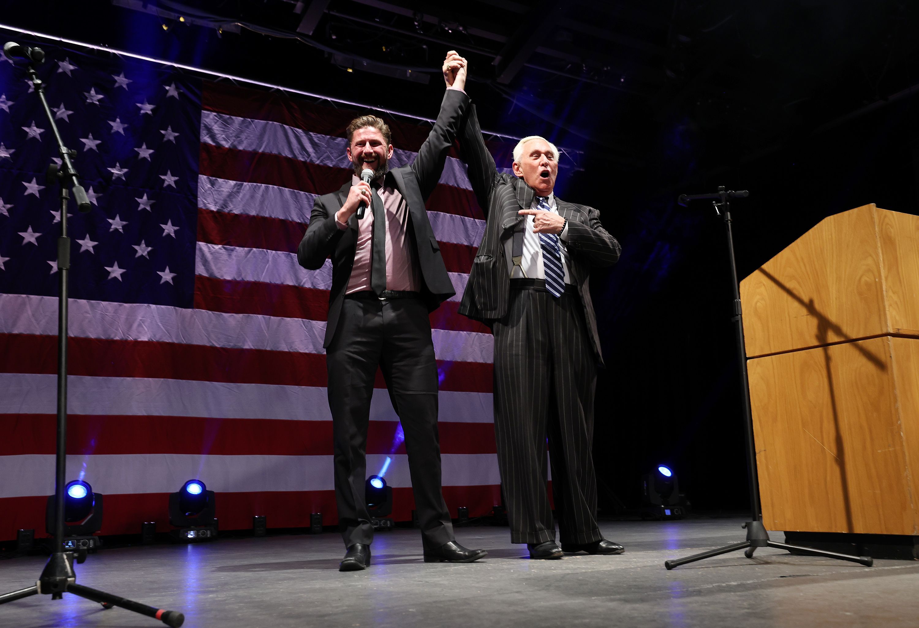 Candidate for the 3rd District Jason Preston, left, stands with Roger Stone, a conservative political consultant and lobbyist, at a rally for Preston at Thanksgiving Point in Lehi on Friday.