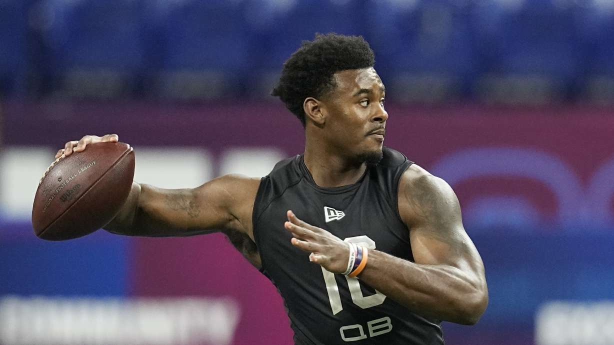 FILE - Liberty quarterback Malik Willis runs a drill during the NFL football scouting combine, Thursday, March 3, 2022, in Indianapolis. Franchises still searching for a prized quarterback won't find much star power in this year's crop of college QBs. Still, there's potential upgrades to be had in the likes of Temple's Malik Willis and Pitt's Kenny Pickett.