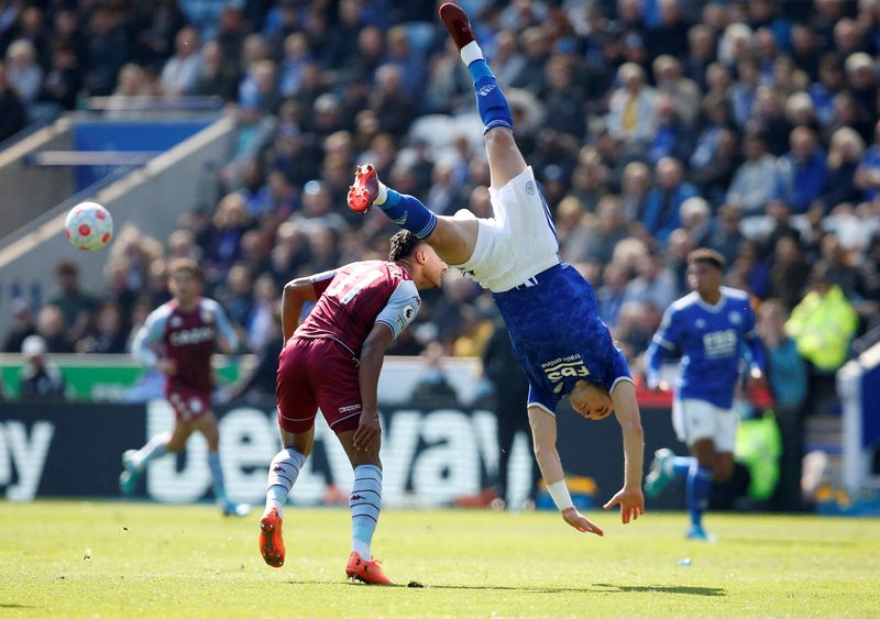 Soccer Football - Premier League - Leicester City v Aston Villa - King Power Stadium, Leicester, Britain - April 23, 2022 Leicester City's Caglar Soyuncu hits the floor after a challenge with Aston Villa's Ollie Watkins