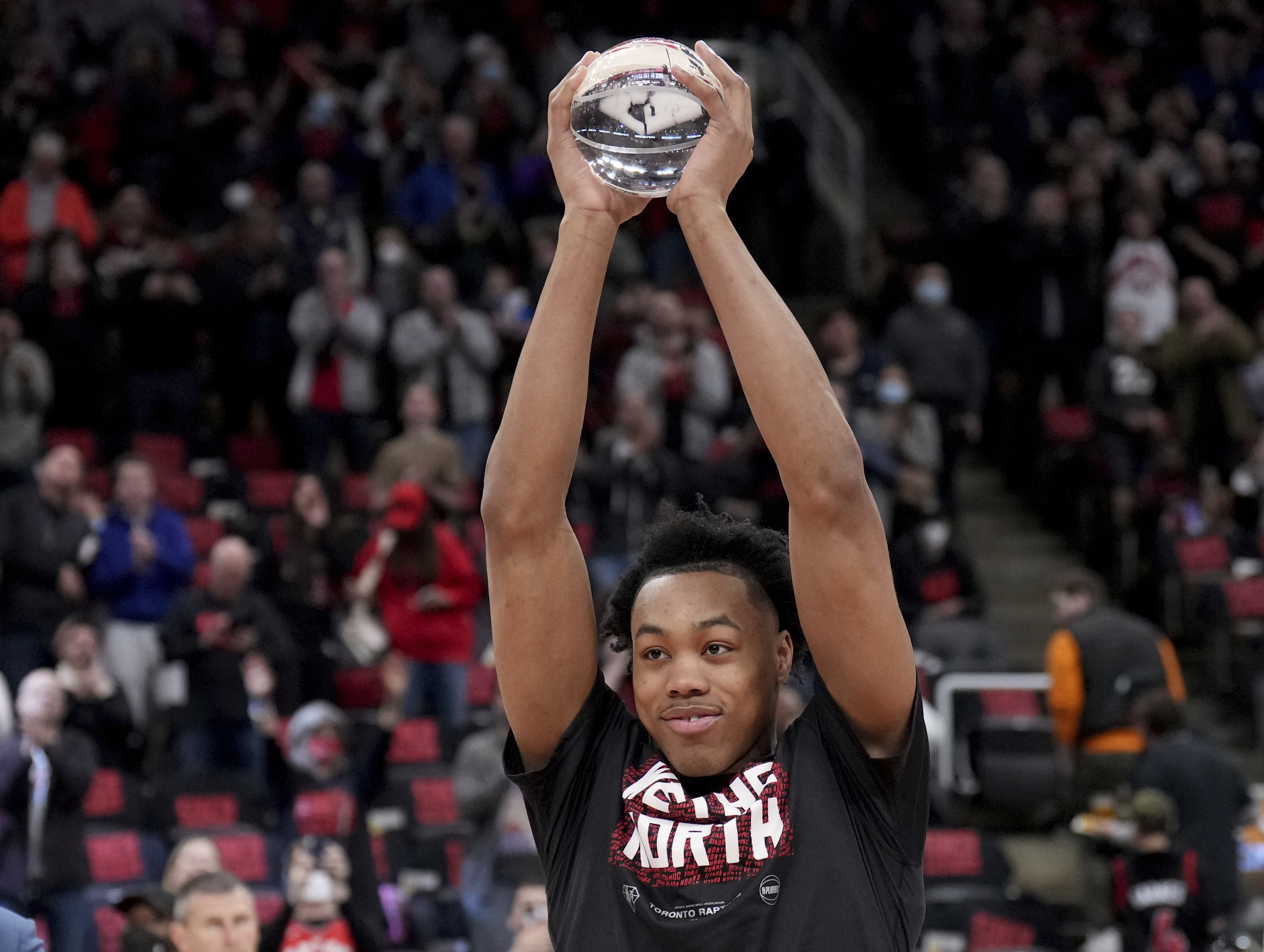 NBA Rookie of the Year, Toronto Raptors forward Scottie Barnes (4) holds up the trophy prior to the first half of Game 4 of an NBA basketball first-round playoff series against the Philadelphia 76ers Saturday, April 23, 2022 in Toronto. 
