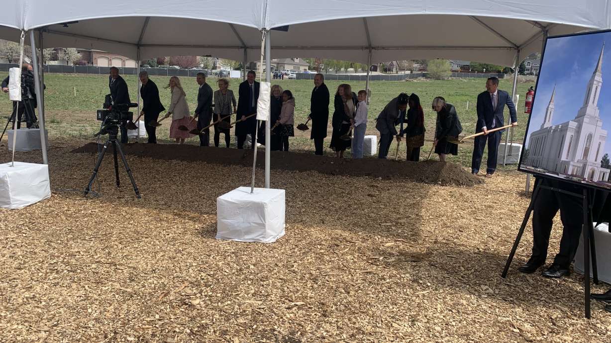 Elder Kevin W. Pearson and others participate in the groundbreaking for the Lindon Utah Temple on Saturday.