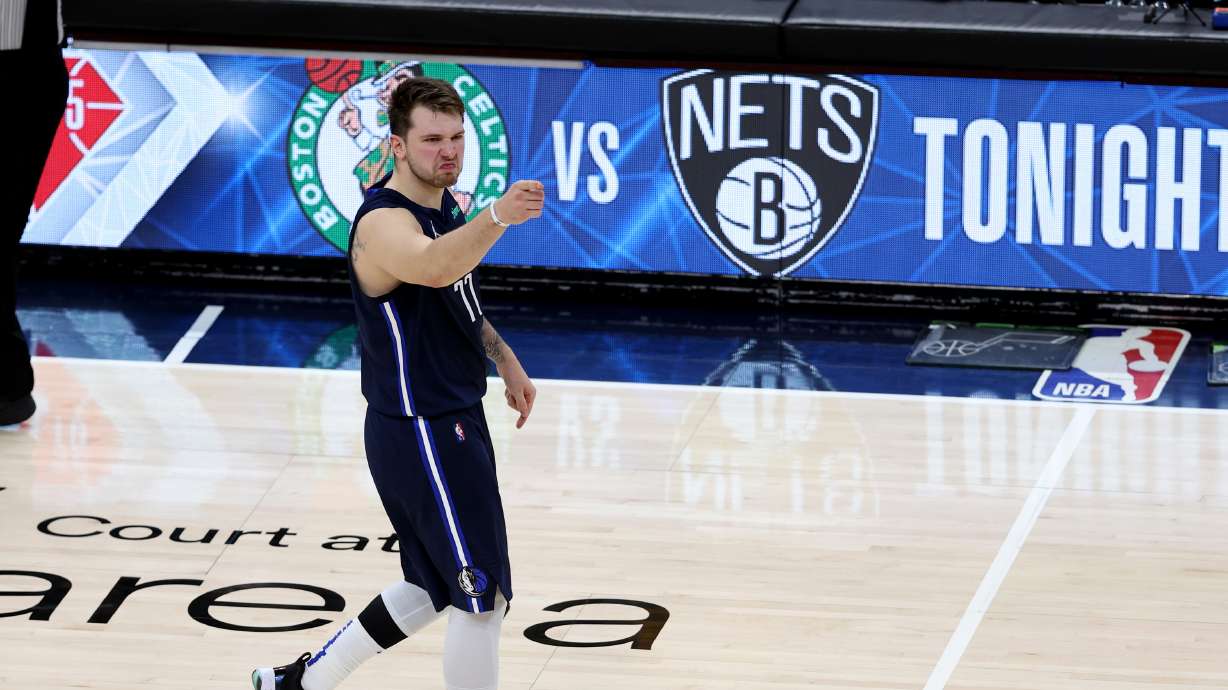 Dallas Mavericks guard Luka Doncic (77) points at fans after hitting a three point shot late in the game as the Utah Jazz and the Dallas Mavericks play game four at Vivint Arena in Salt Lake City on Saturday, April 23, 2022. Utah won 100-99.
