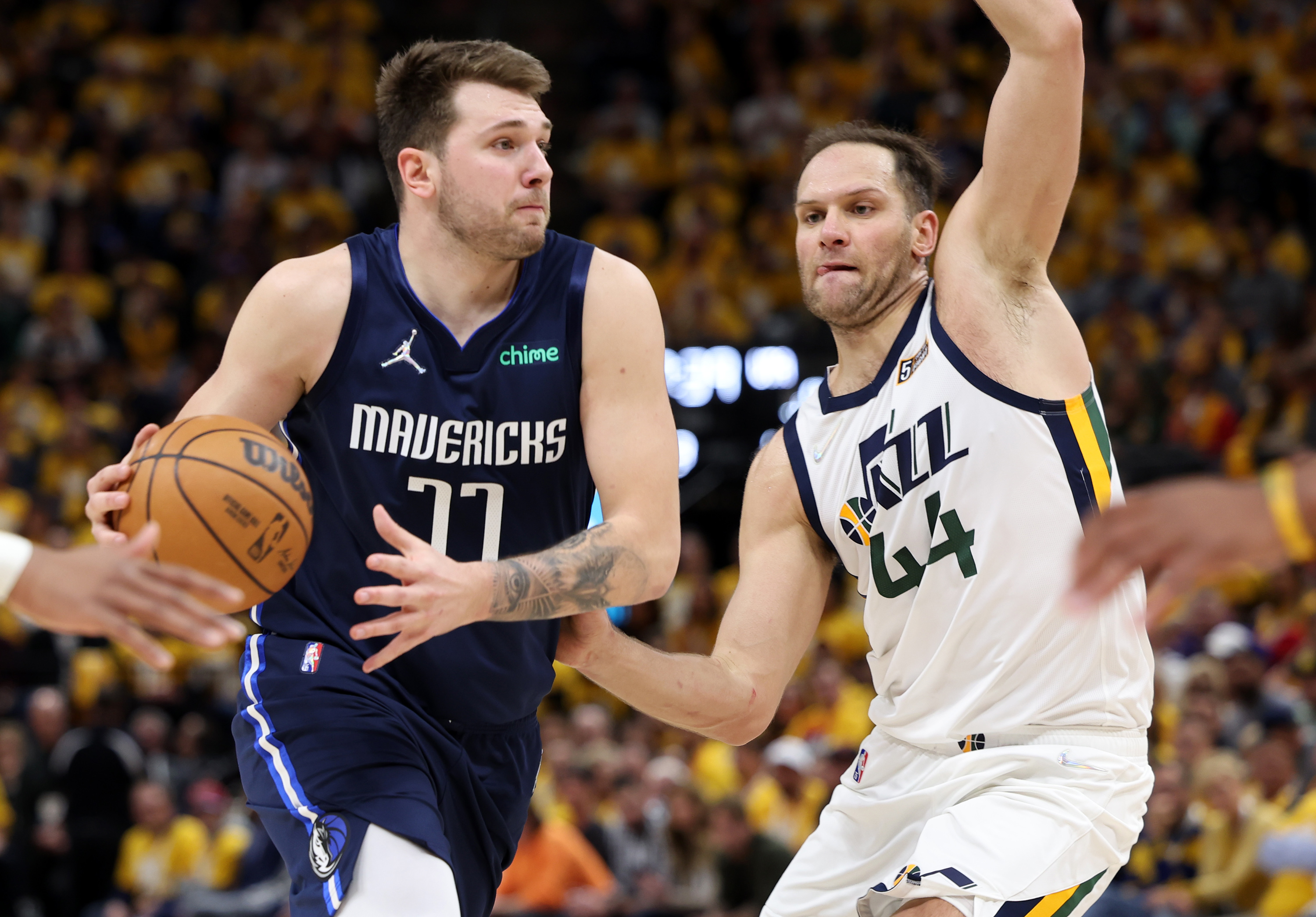 Utah Jazz forward Bojan Bogdanovic tries to guard Dallas Mavericks guard Luka Doncic (77) as the Utah Jazz and the Dallas Mavericks play game four at Vivint Arena in Salt Lake City on Saturday, April 23, 2022. Utah won 100-99.