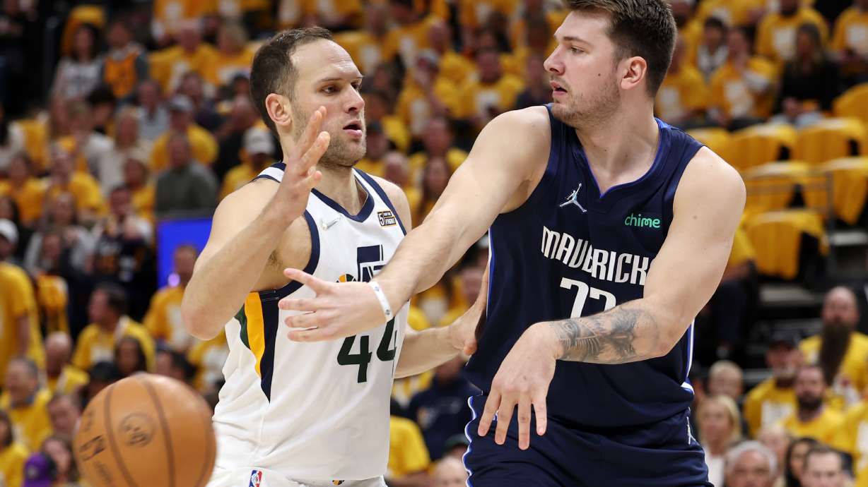 Utah Jazz forward Bojan Bogdanovic (44) guards Dallas Mavericks guard Luka Doncic (77) as the Utah Jazz and the Dallas Mavericks play game four at Vivint Arena in Salt Lake City on Saturday, April 23, 2022.