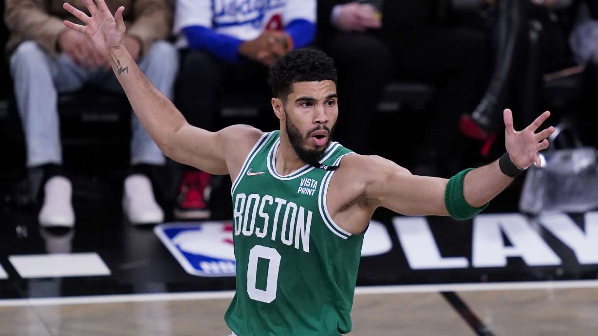 Boston Celtics forward Jayson Tatum (0) reacts to a referee's call during the first half of Game 3 of the team's NBA basketball first-round playoff series against the Brooklyn Nets, Saturday, April 23, 2022, in New York.