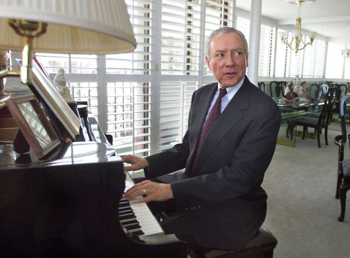 Sen. Orrin Hatch, R-Utah, sits at his piano at his home in Salt Lake City on March 31, 2001.