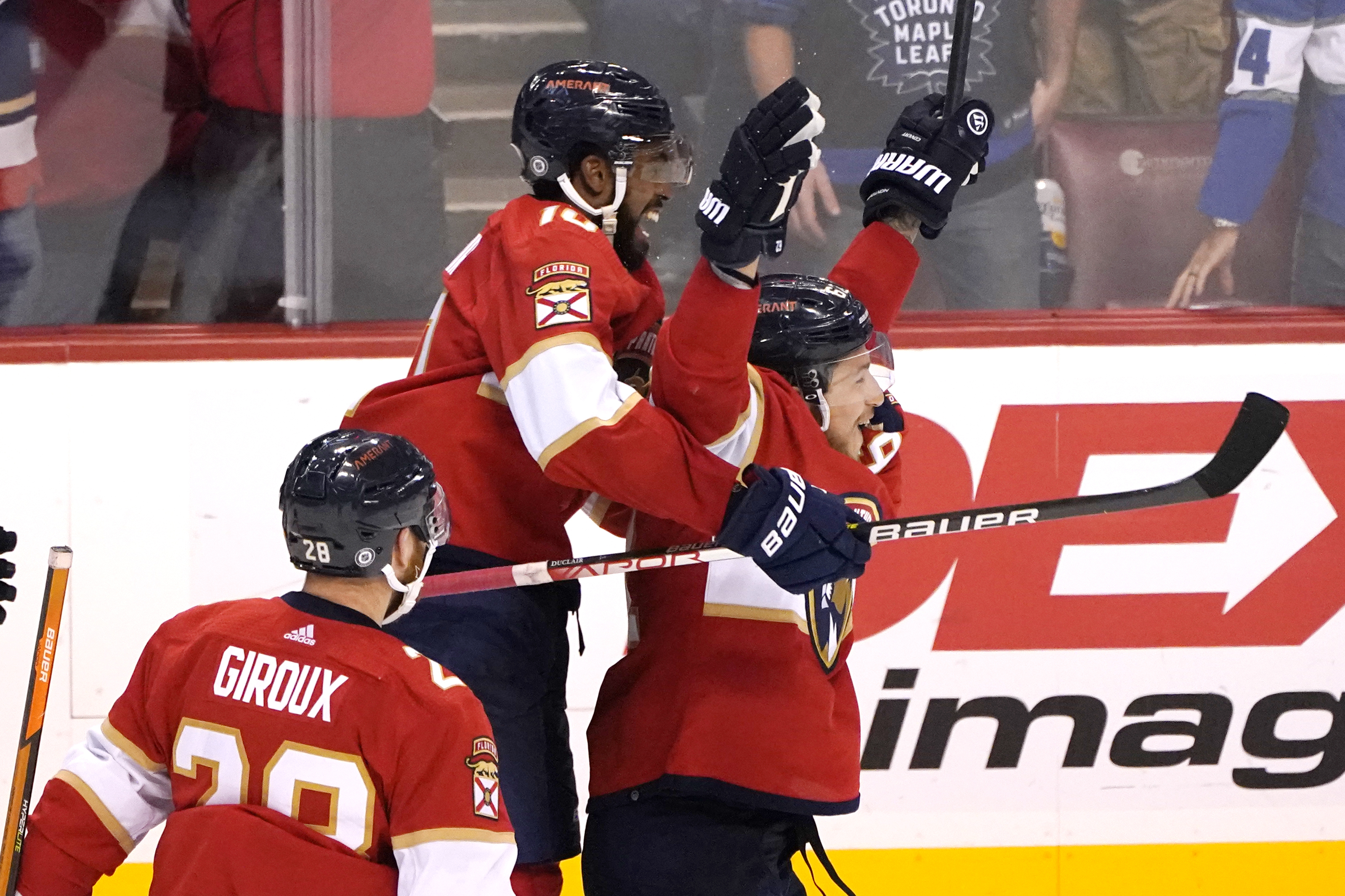 Florida Panthers left wing Anthony Duclair, left, celebrates with defenseman Brandon Montour, right, after Montour scored against the Toronto Maple Leafs in overtime of an NHL hockey game Saturday, April 23, 2022, in Sunrise, Fla. The Panthers won 3-2. 