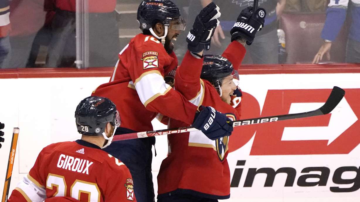 Florida Panthers left wing Anthony Duclair, left, celebrates with defenseman Brandon Montour, right, after Montour scored against the Toronto Maple Leafs in overtime of an NHL hockey game Saturday, April 23, 2022, in Sunrise, Fla. The Panthers won 3-2.