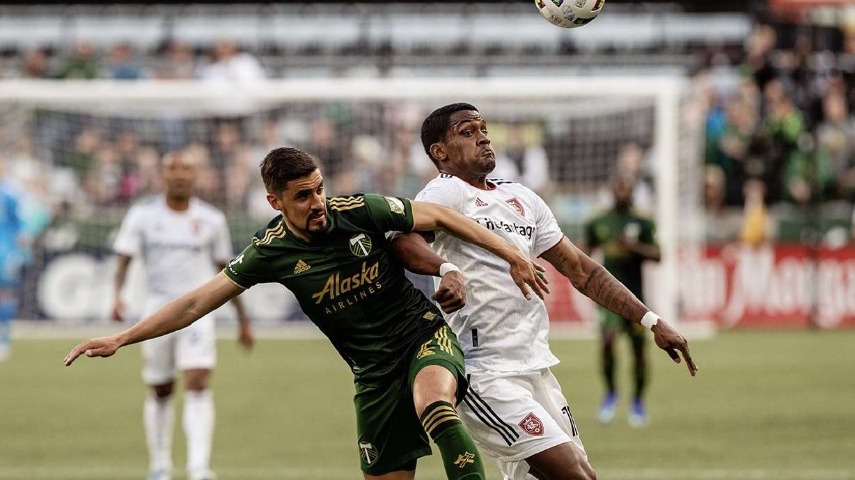 Sergio Cordova, right, fights off a Portland defender on Saturday.