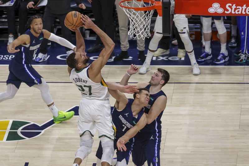 Apr 23, 2022; Salt Lake City, Utah, USA; Utah Jazz center Rudy Gobert (27) shoots the ball over Dallas Mavericks center Dwight Powell (7) during the fourth quarter in game four of the first round for the 2022 NBA playoffs at Vivint Arena. Utah Jazz won 100-00.