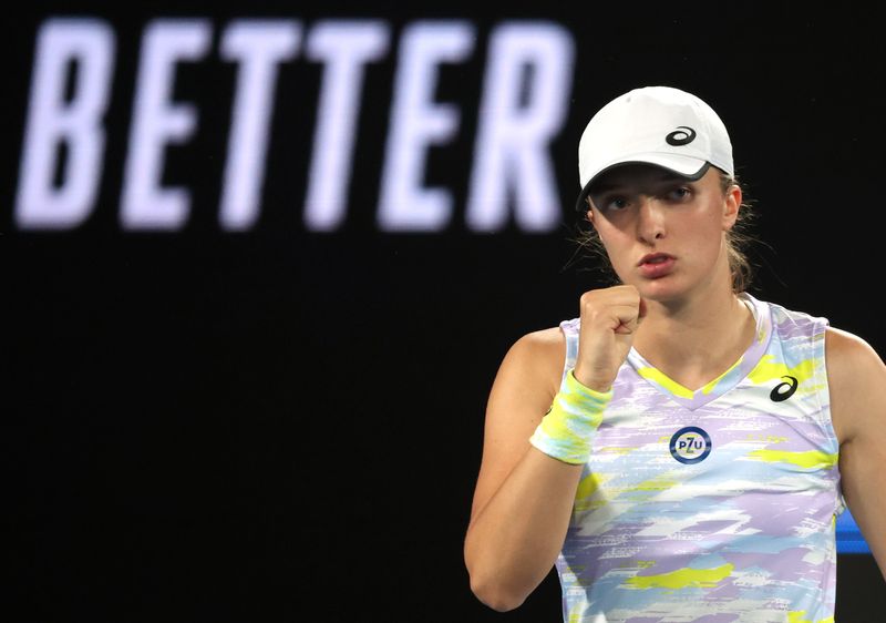 FILE PHOTO: Tennis - Australian Open - Melbourne Park, Melbourne, Australia - January 27, 2022  Poland's Iga Swiatek reacts during her semi final match against Danielle Collins of the U.S.