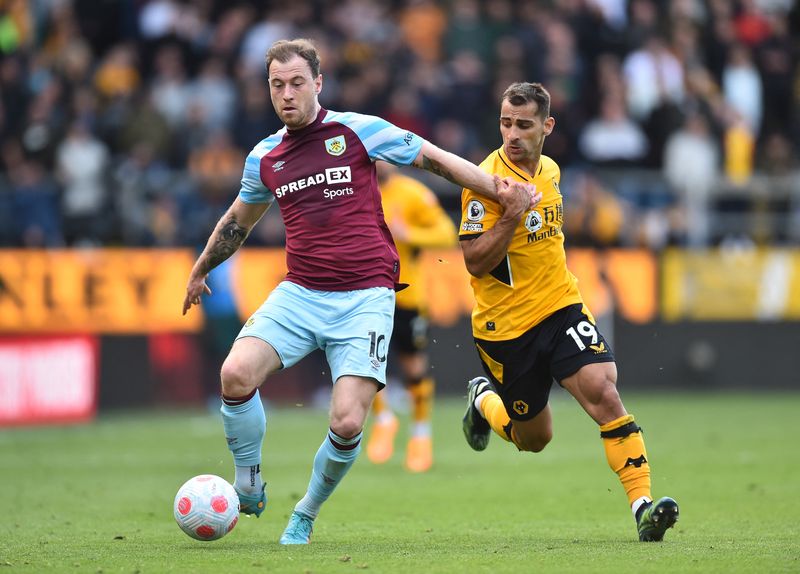 Soccer Football - Premier League - Burnley v Wolverhampton Wanderers - Turf Moor, Burnley, Britain - April 24, 2022  Burnley's Ashley Barnes in action with Wolverhampton Wanderers' Jonny