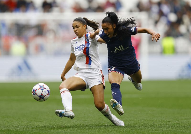 Soccer Football - Women’s Champions League - Semi Final - First Leg - Olympique Lyonnais v Paris St Germain - Groupama Stadium, Lyon, France - April 24, 2022 Olympique Lyonnais' Delphine Cascarino in action with  Paris Saint-Germain's Sakina Karchaoui