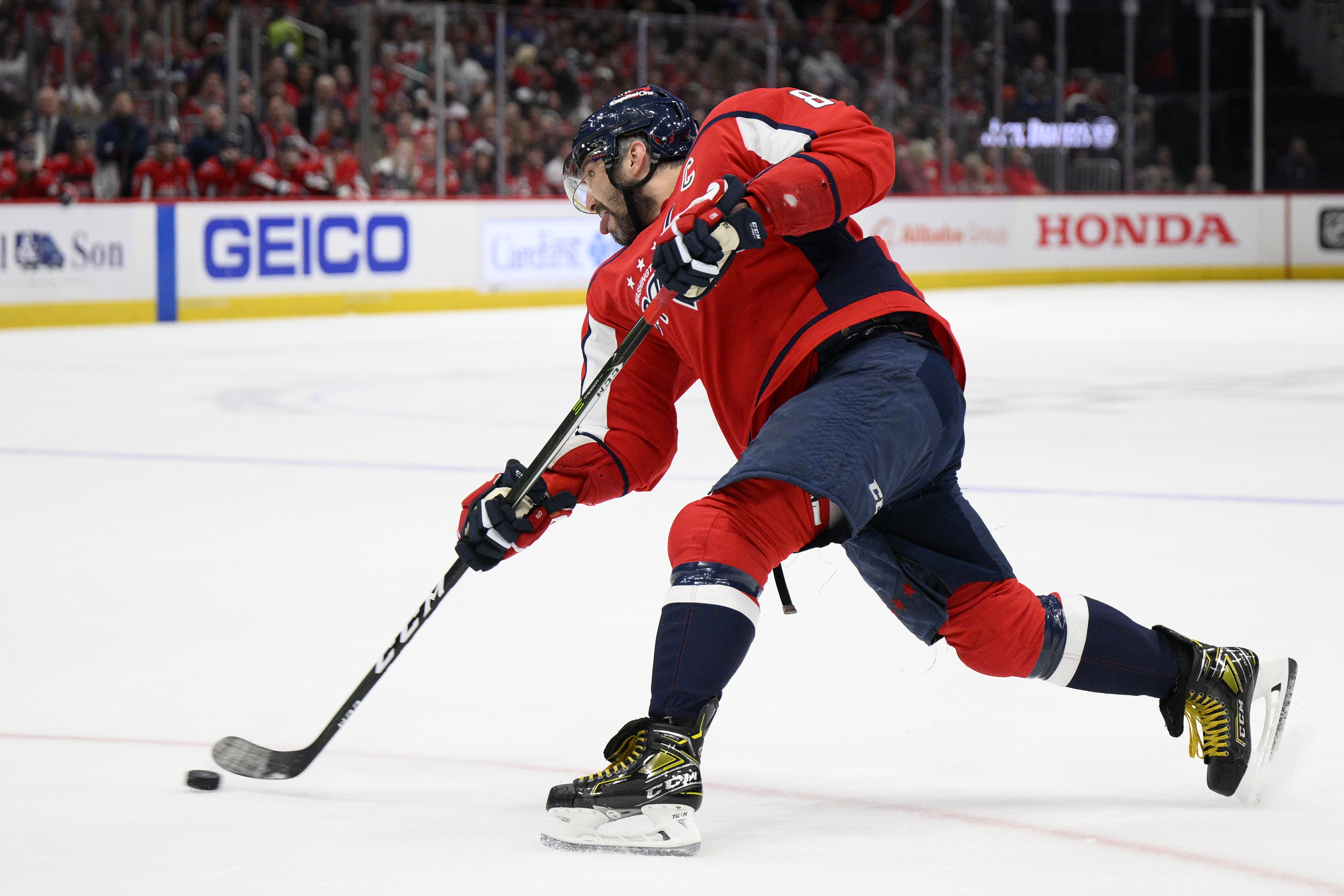 Washington Capitals left wing Alex Ovechkin (8) shoots during the first period of an NHL hockey game against the Toronto Maple Leafs, Sunday, April 24, 2022, in Washington. 