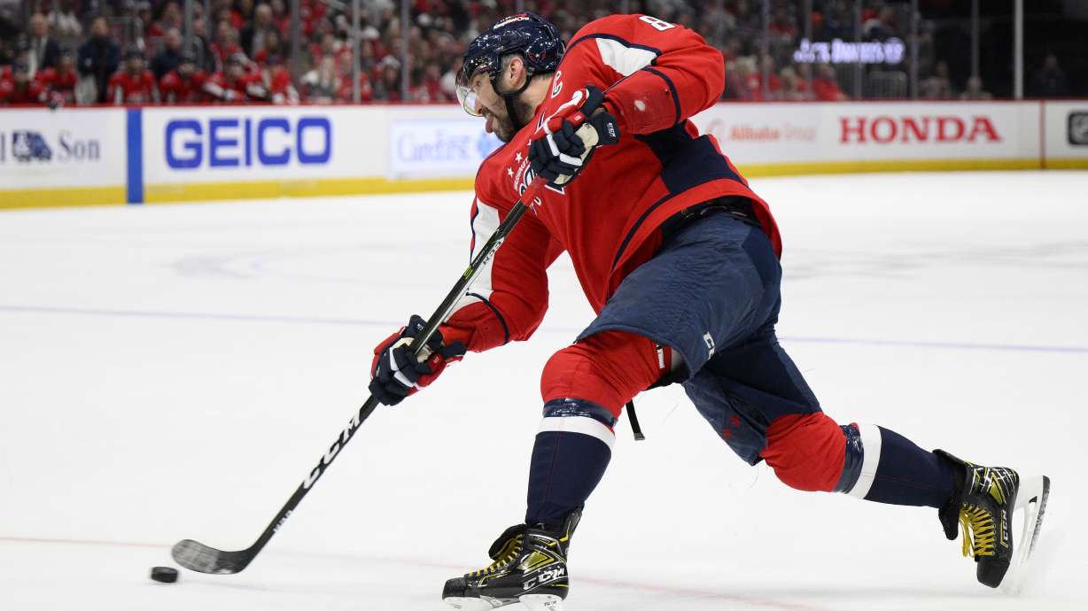 Washington Capitals left wing Alex Ovechkin (8) shoots during the first period of an NHL hockey game against the Toronto Maple Leafs, Sunday, April 24, 2022, in Washington.