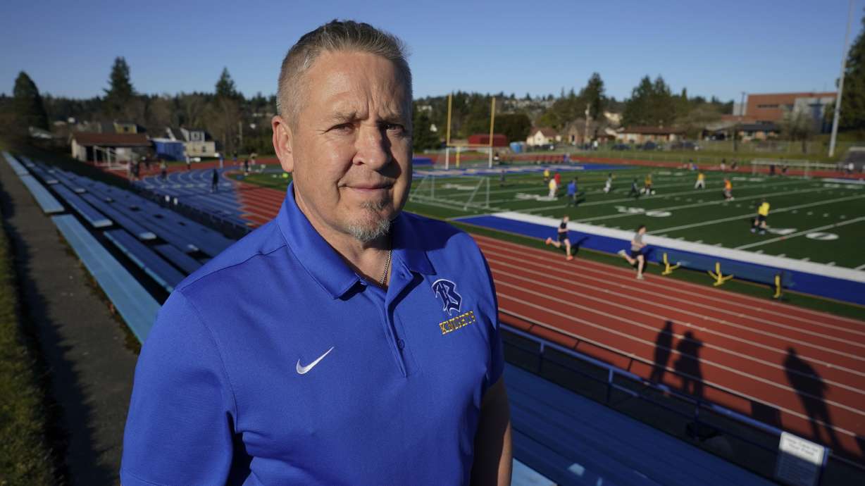 Joe Kennedy, a former assistant football coach at Bremerton High School in Bremerton, Wash., poses for a photo March 9 at the school's football field. After losing his coaching job for refusing to stop kneeling in prayer with players and spectators on the field immediately after football games, Kennedy will take his arguments before the U.S. Supreme Court on Monday.