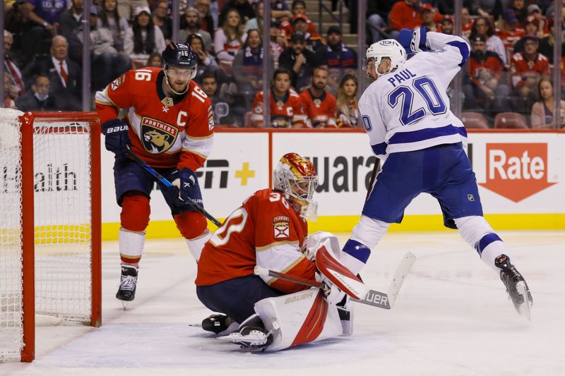 Apr 24, 2022; Sunrise, Florida, USA; Tampa Bay Lightning left wing Nicholas Paul (20) scores on Florida Panthers goaltender Spencer Knight (30) during the second period at FLA Live Arena.