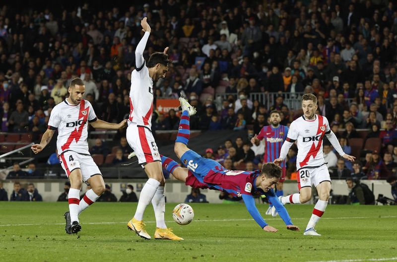 Soccer Football - LaLiga - FC Barcelona v Rayo Vallecano - Camp Nou, Barcelona, Spain - April 24, 2022 FC Barcelona's Gavi in action with Rayo Vallecano's Alejandro Catena