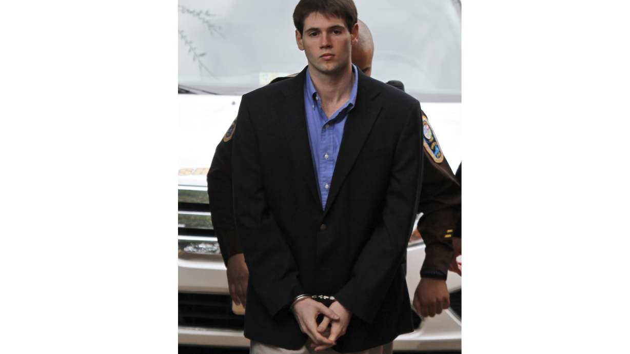 FILE - George Huguely is escorted into the Charlottesville Circuit courthouse in Charlottesville, Va., Wednesday, Feb. 22, 2012. Huguely, who was convicted of second-degree murder in the 2010 killing of a University of Virginia lacrosse player, is headed back to court as jury selections are expected Monday, April 25, 2022, for a civil trial in a wrongful death lawsuit.