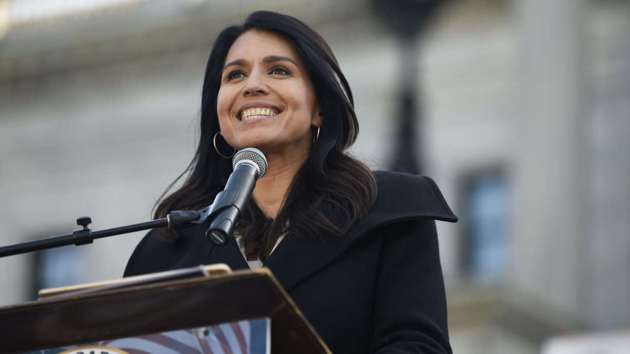 Former Democratic presidential contender Tulsi Gabbard at a Martin Luther King Jr. Day rally on Jan. 20, 2020, in Columbia, S.C. Gabbard is demanding Sen. Mitt Romney take down a March tweet in which he alleged she was "parroting false Russian propaganda" and that her statements were "treasonous lies."