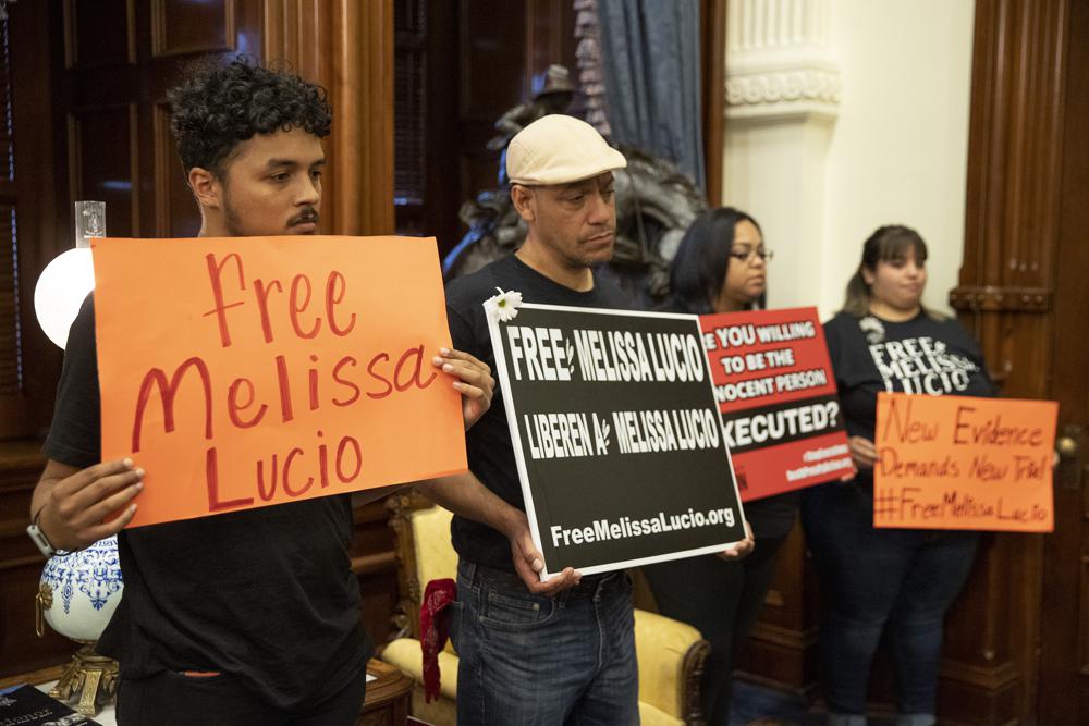 Supporters of death row inmate Melissa Lucio, including Justin Rosario, left to right, Mark Anthony Vasquez, April Agosto and Amerika Leija, wait in the Governor's Public Reception Room at the Capitol, in Austin, Texas, on Monday for a decision from the Board of Pardons and Paroles about her clemency. A Texas appeals court on Monday delayed Lucio's execution.