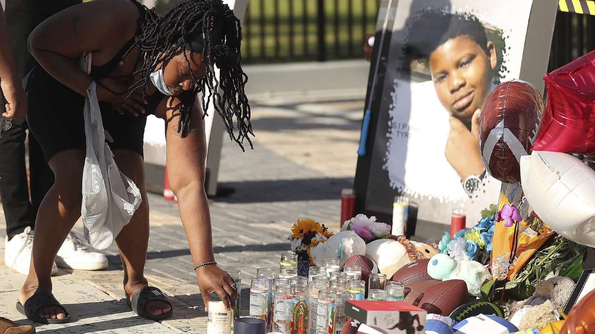 Family members and friends of Tyre Sampson, 14, leave items during a vigil in front of the Orlando Free Fall drop tower in ICON Park in Orlando on March 28. Sampson's parents filed a lawsuit after the teen fell to his death.