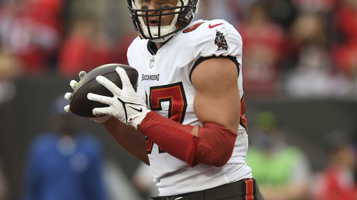 FILE - Tampa Bay Buccaneers tight end Rob Gronkowski catches a touchdown pass against the Philadelphia Eagles during the second half of an NFL wild-card football game Jan. 16, 2022, in Tampa, Fla. No position in the NFL has undergone more changes to the style of player over the years than tight end. Long gone are the days of the blocking specialists who serve mainly as an extra offensive lineman. While guys like George Kittle, Travis Kelce and Gronkowski are excellent run-blockers, they are also outstanding receivers and major weapons on offense.