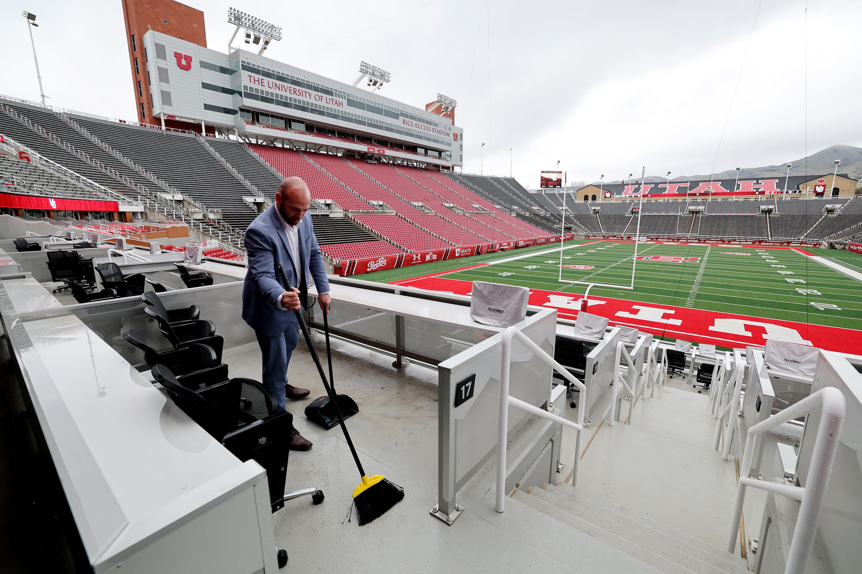 Dan Robinson, general manager of the Ken Garff Scholarship Club, works to clean the seating area at the south end of the stadium at Rice-Eccles Stadium on Friday. The International Olympic Committee's trio of technical experts will inspect Utah's proposed 2030 or 2034 Winter Games venues this week as part of the bid process.