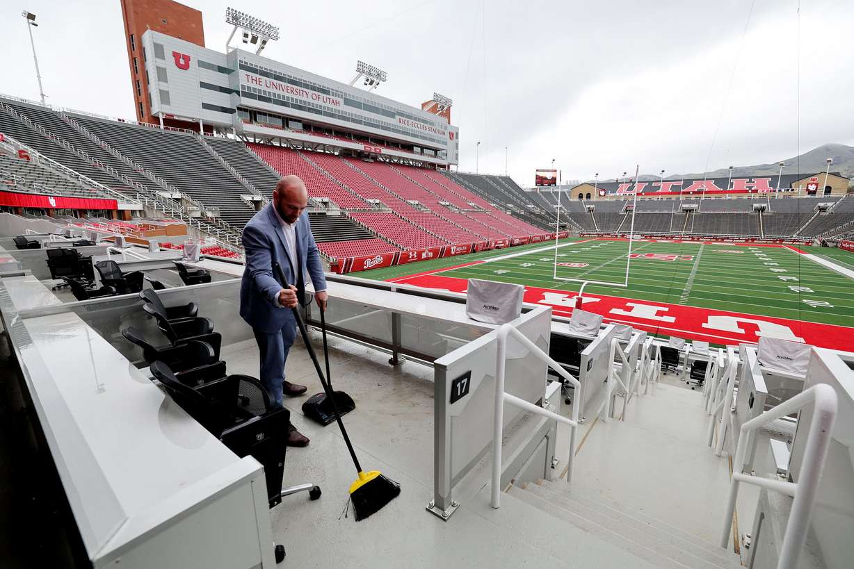 Dan Robinson, general manager of the Ken Garff Scholarship Club, works to clean the seating area at the south end of the stadium at Rice-Eccles Stadium on Friday. The International Olympic Committee's trio of technical experts will inspect Utah's proposed 2030 or 2034 Winter Games venues this week as part of the bid process.