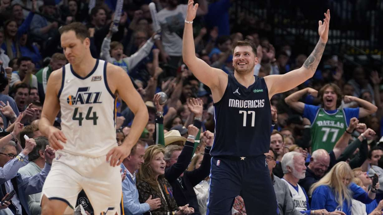 Dallas Mavericks guard Luka Doncic (77) celebrates behind Utah Jazz forward Bojan Bogdanovic (44) after scoring during the second half of Game 5 of an NBA basketball first-round playoff series, Monday, April 25, 2022, in Dallas.
