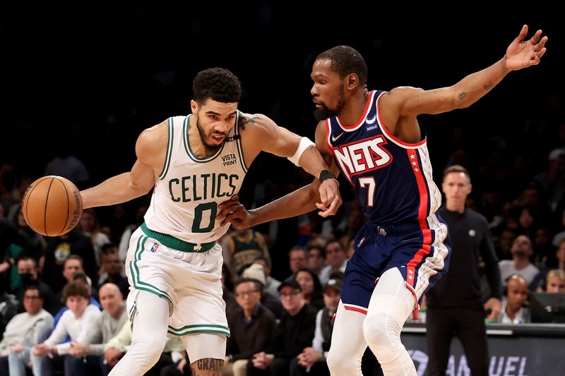 Apr 25, 2022; Brooklyn, New York, USA; Boston Celtics forward Jayson Tatum (0) drives to the basket against Brooklyn Nets forward Kevin Durant (7) during the fourth quarter of game four of the first round of the 2022 NBA playoffs at Barclays Center. The Celtics defeated the Nets 116-112 to win the best of seven series 4-0.