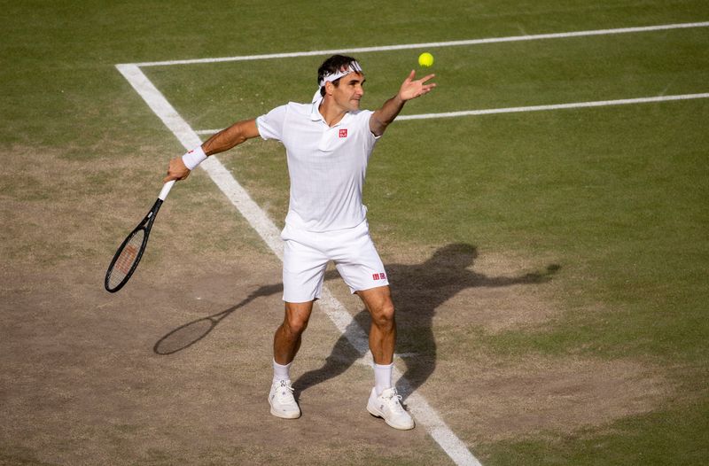 FILE PHOTO: Tennis - Wimbledon - All England Lawn Tennis and Croquet Club, London, Britain - July 7, 2021 Switzerland's Roger Federer in action during his quarter final match against Poland's Hubert Hurkacz