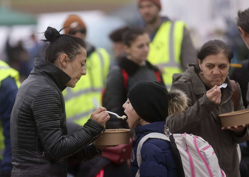 Mariana Lakatosh feeds her daughter soup at the Ukrainian/Polish border in Medyka, Poland, on April 18.