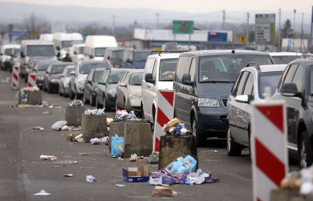 Vehicles are lined up to cross the border from Poland into Ukraine in Medyka, Poland, on Thursday. Drivers at the front of the line claimed they have been in line for three days.