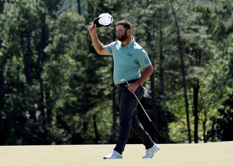 FILE PHOTO: Golf - The Masters - Augusta National Golf Club - Augusta, Georgia, U.S. - April 10, 2022 Spain's Jon Rahm on the 18th green after finishing his final round
