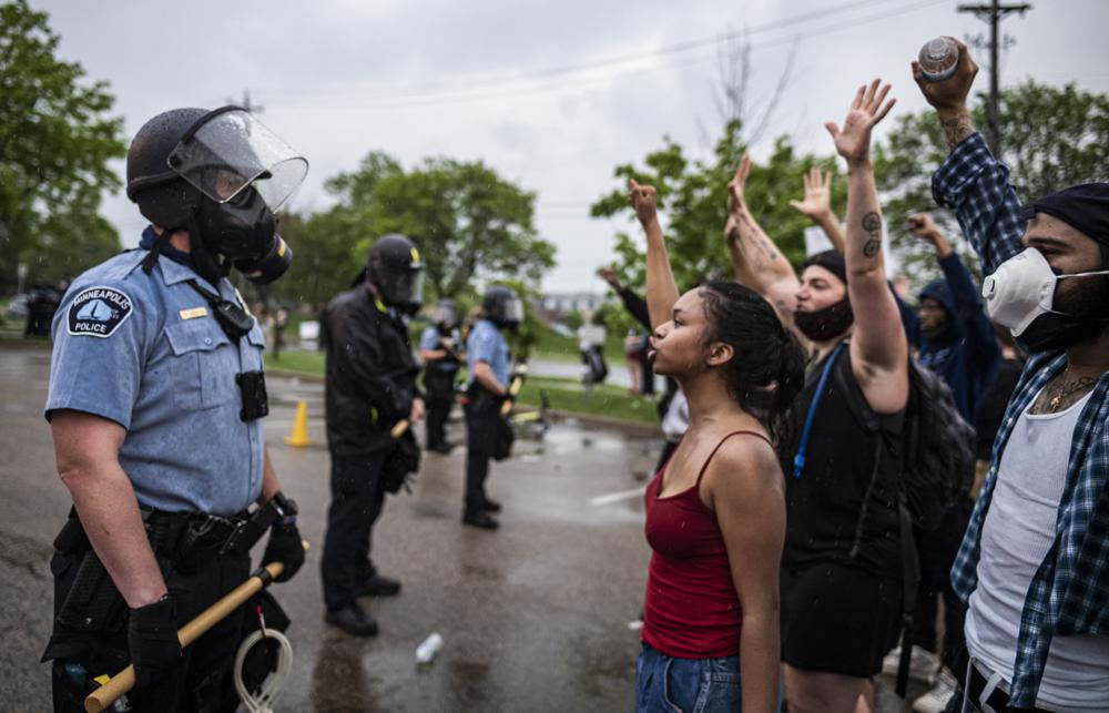 Protesters and police face each other during a rally for George Floyd in Minneapolis on May 26, 2020. Almost two years after George Floyd died at the hands of four Minneapolis police officers, a state investigation has determined that the department engages in a pattern of race discrimination.