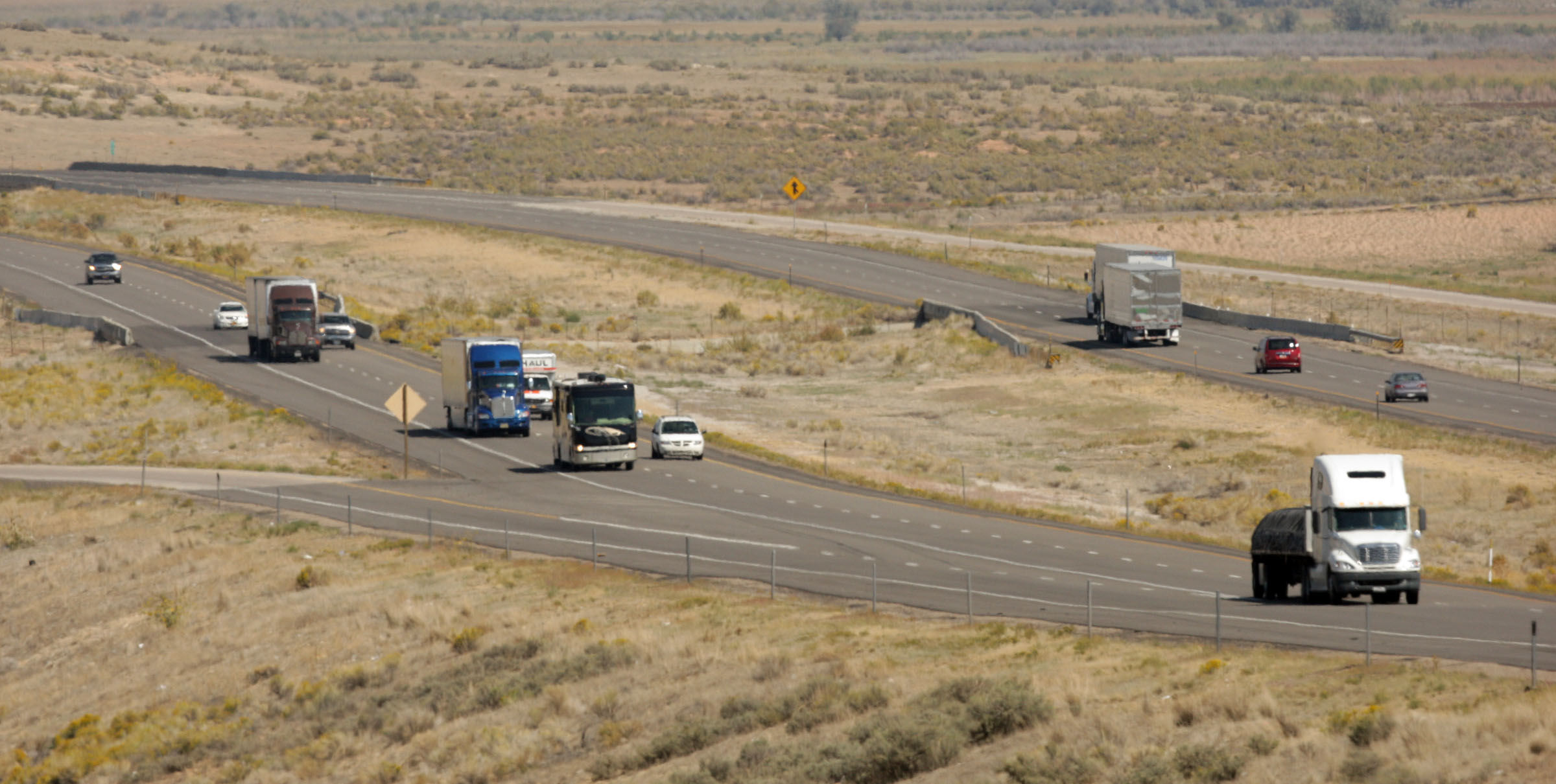 A Utah man accused of randomly shooting at vehicles on I-15 between Nephi and Scipio late last year has been charged and arrested, police confirmed Tuesday.