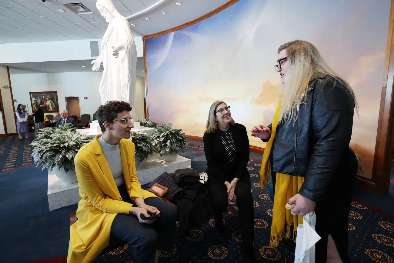 Jeanne Woodbury, left, Janine Skinner and Sarah Burlingame chat as LGBT leaders meet at the visitors’ center after touring The Church of Jesus Christ of Latter-day Saints’ Washington D.C. Temple in Kensington, Maryland, on Wednesday, April 20.