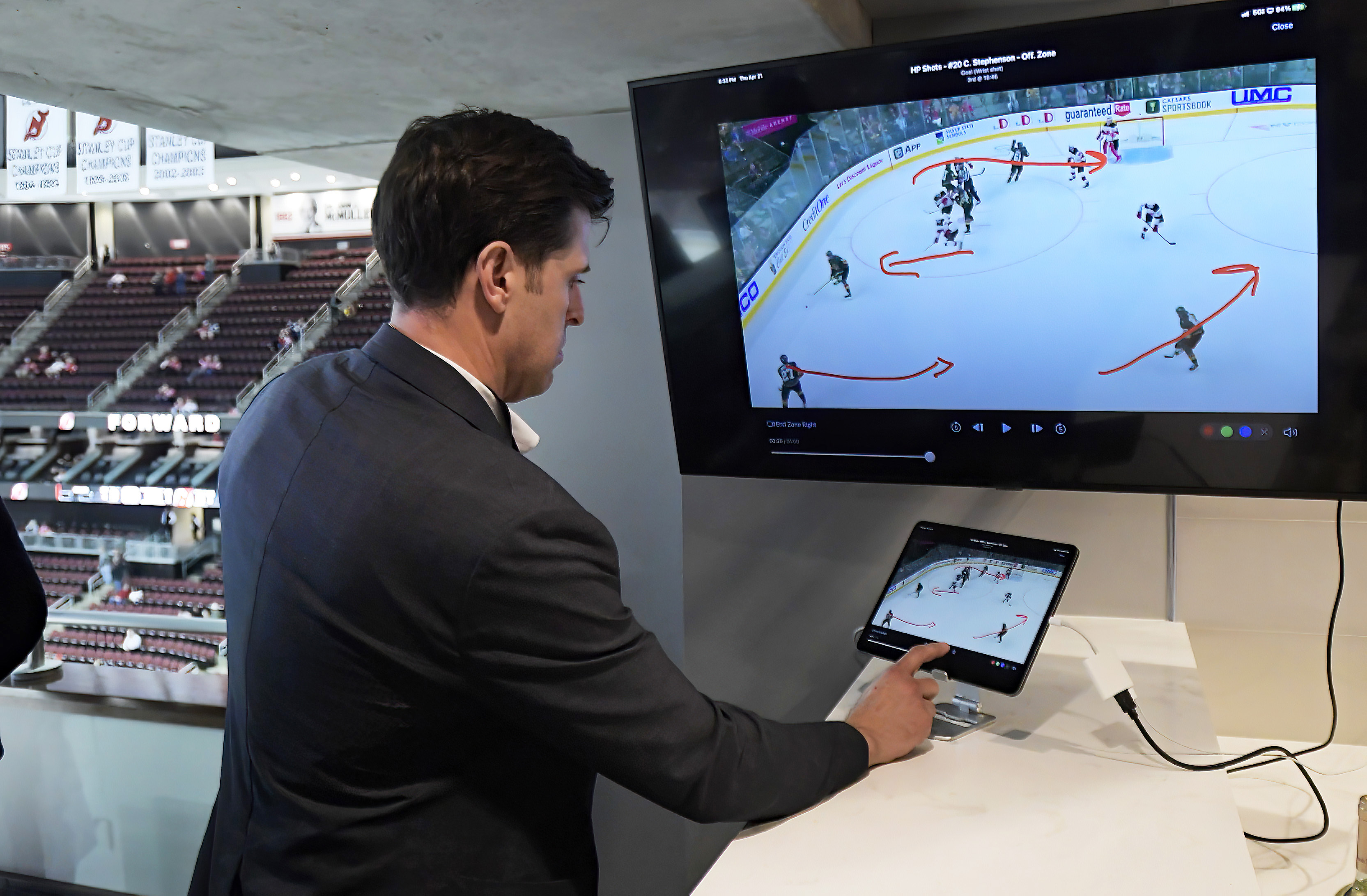 NHL senior director of coaching and general manager of technology Brant Berglund demonstrates the latest advances in puck and player tracking at a tech showcase before an NHL hockey game between the Buffalo Sabres and New Jersey Devils,Thursday, April 21, 2022, in Newark, N.J. Some data from the NHL’s puck and player tracking system is expected to be publicly available during the upcoming playoffs, and that’s just the start of some of the technological twists that are coming to hockey arenas and broadcasts sooner than later. Custom camera angles and replays for fans at their seats and virtual and augmented reality are among the advancements the league is working on. 