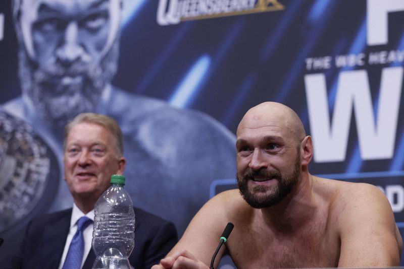 FILE PHOTO: Boxing - Tyson Fury v Dillian Whyte - WBC World Heavyweight Title - Wembley Stadium, London, Britain - April 23, 2022 Tyson Fury with promoter Frank Warren during a press conference after the fight Action Images via Reuters/Andrew Couldridge